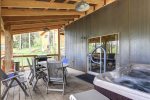 Lower back deck with hot tub and table/chairs